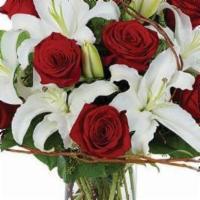 Red Roses · 18 long stem red roses beautifully arranged with foliage in a clear glass vase. (Item #: B59...