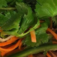 Green Salad · Mixed greens with carrots and cucumber in a ginger dressing.