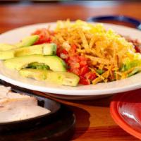 Sizzling Cabo Salad · Tomatoes, bacon, avocados,. cheese and croutons on a bed of. fresh mixed greens, and choice ...
