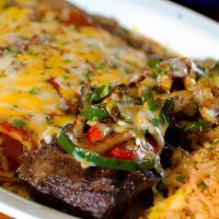 Steak & Enchiladas · Fire-grilled fajita steak topped with.  mixed peppers and cheese, paired.  with two cheese e...