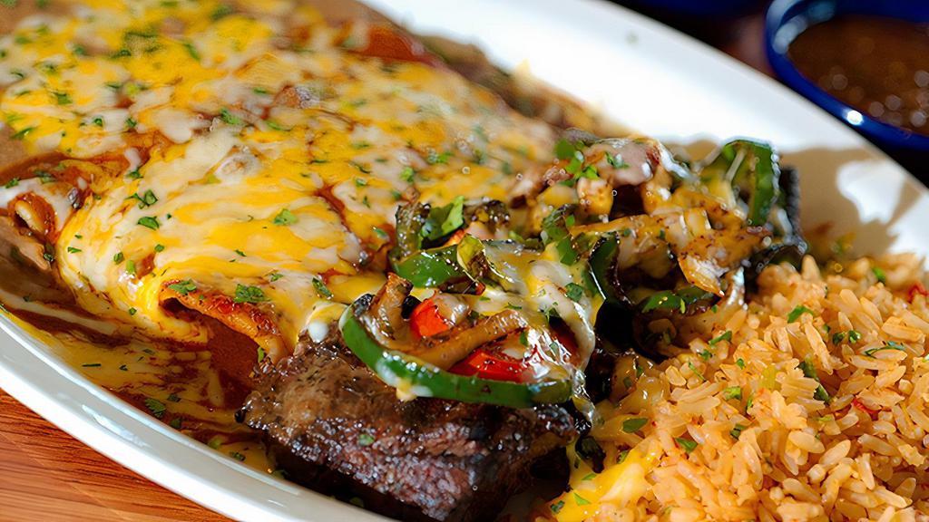 Steak & Enchiladas · Fire-grilled fajita steak topped with.  mixed peppers and cheese, paired.  with two cheese enchiladas. Served with Mexican rice and refried beans.