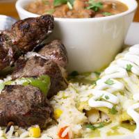 Akaushi Steak Skewers & Enchiladas · Two skewers of Ancho Marinated.  Akaushi Beef served with coastal.  rice, beans and your cho...