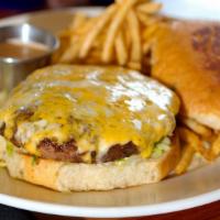 Wood Grilled Angus Cheeseburger · Half pound Angus Burger topped.  with mixed cheese, lettuce and.  tomato. Served on a toaste...