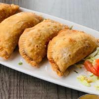 Empanadas · Empanadas filled with a blend of cheese and chicken. Served with chile con queso and jalapeñ...