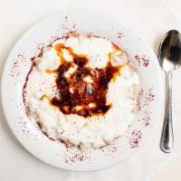 Manti (Turkish Ravioli) · Homemade Turkish ravioli, yogurt, tomato sauce.