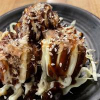 Takoyaki 5 Pieces · Small batter balls filled with octopus pieces with special sauce.