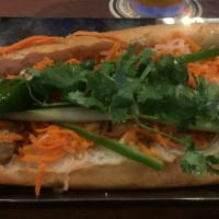 Spicy Tofu Banh Mi · Spicy. Served on toasted baguette with pickled veggies, cucumbers, sliced jalapeños, cilantr...