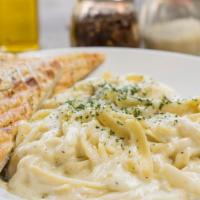 Fettucine Alfredo · add chicken for an additional charge.
