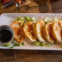 Potstickers (6) · Pan-fried dumplings, served with ginger soy dipping sauce.