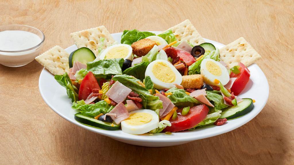 Chef Salad  · Cal. 230. Lettuce mix, ham, black olives, green peppers, red onions, cheddar cheese, fresh tomatoes, sliced cucumbers, crispy bacon, eggs and croutons. (Choice of salad dressing Cal. 20-320).