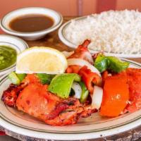 Tandoori Chicken(2)
 · Two pieces of Breast and leg. Tender chicken marinated in yogurt and herbs, broiled over mes...