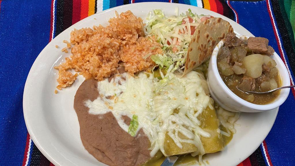 Combination #2 · 2 Cheese Enchiladas, 1 Shredded Beef Taco, Green Chile with Meat, served with refried beans and a flour tortilla