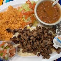 Steak Taco Plate · Four tacos served with guacamole, sour cream, pico de gallo, mexican rice, charro beans and ...