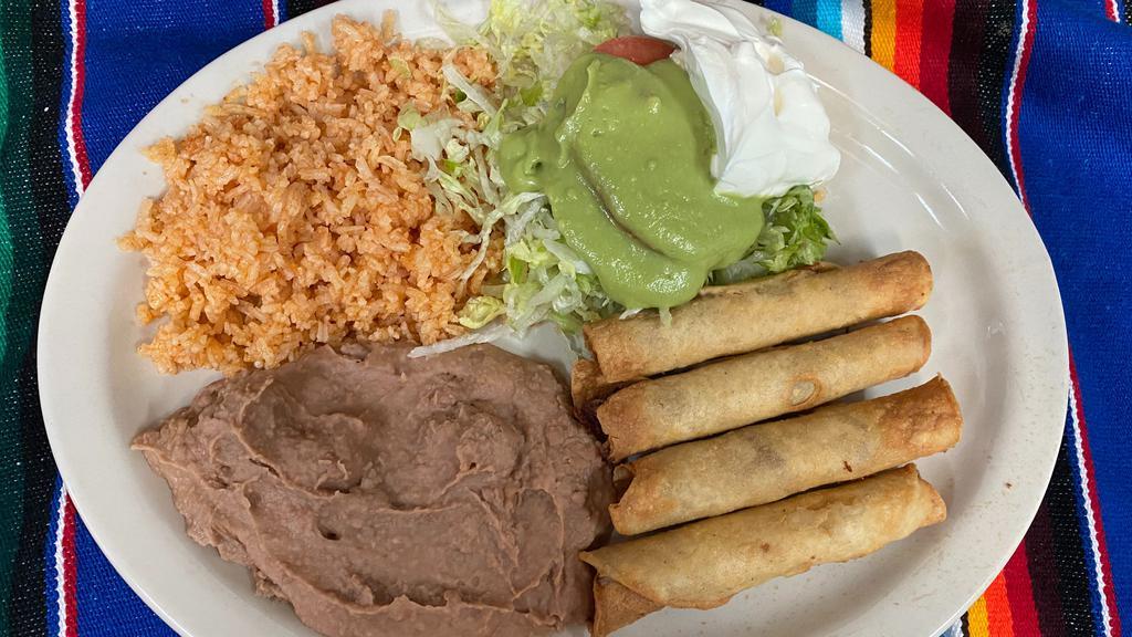 Flauta Plate · Four flautas, shredded beef or chicken, with sour cream and guacamole, served with mexican rice, refried beans and salad.