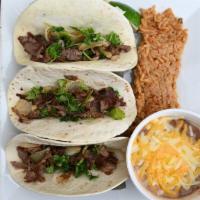 Street Tacos · Three soft flour tacos with grilled steak, sautéed onions, lime and cilantro.