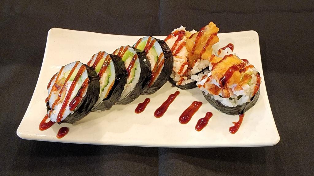 Spider Roll · Deep fried soft shell crab meat with avocado, cucumber topped with sweet sauce.