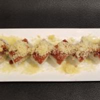 Zena Fire Roll · Hot. Shrimp tempura, avocado and crabmeat topped with spicy tuna, crunch flakes and zena spe...