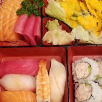 Sushi Sashimi Bento · 6 pcs total of salmon and tuna sashimi and 5 pcs of sushi. Served with four pieces cali roll...