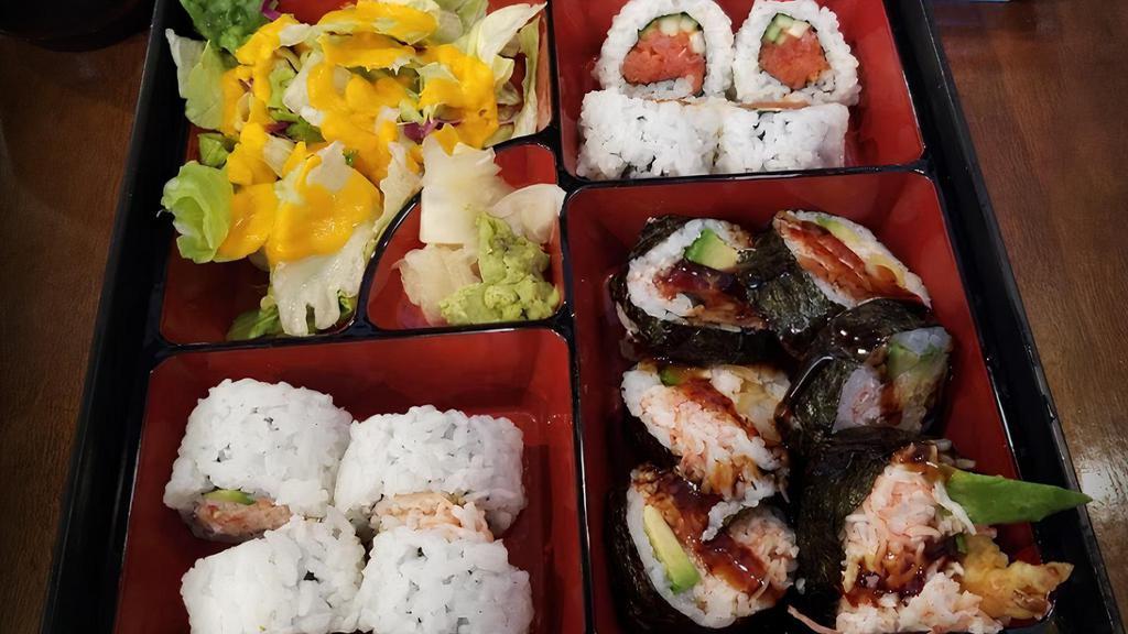 Roll Bento · 6 pcs shrimp empura roll, 4 pcs spicy tuna roll, 4 pcs California roll. Served with four pieces cali roll, house salad, and miso soup.