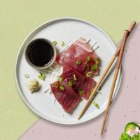 Tuna Sashimi · Six pieces of tuna sashimi.