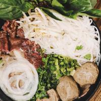 Pho Bo · Filet mignon, well done brisket, tendon meat ball in 24-hour simmered beef broth.