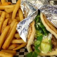 Gyro Sandwich · Mixture of chopped beef with a touch of lamb served in a grilled pita with tomatoes, lettuce...