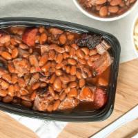 T-Man · Chunks of beef and sliced sausage topped with beans and sauce.
