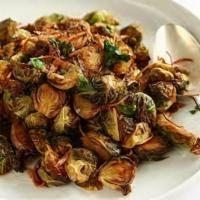 Fried Brussels Sprouts · Fried brussels sprouts tossed with chili fish sauce, fresh onions and cabbage, topped with c...