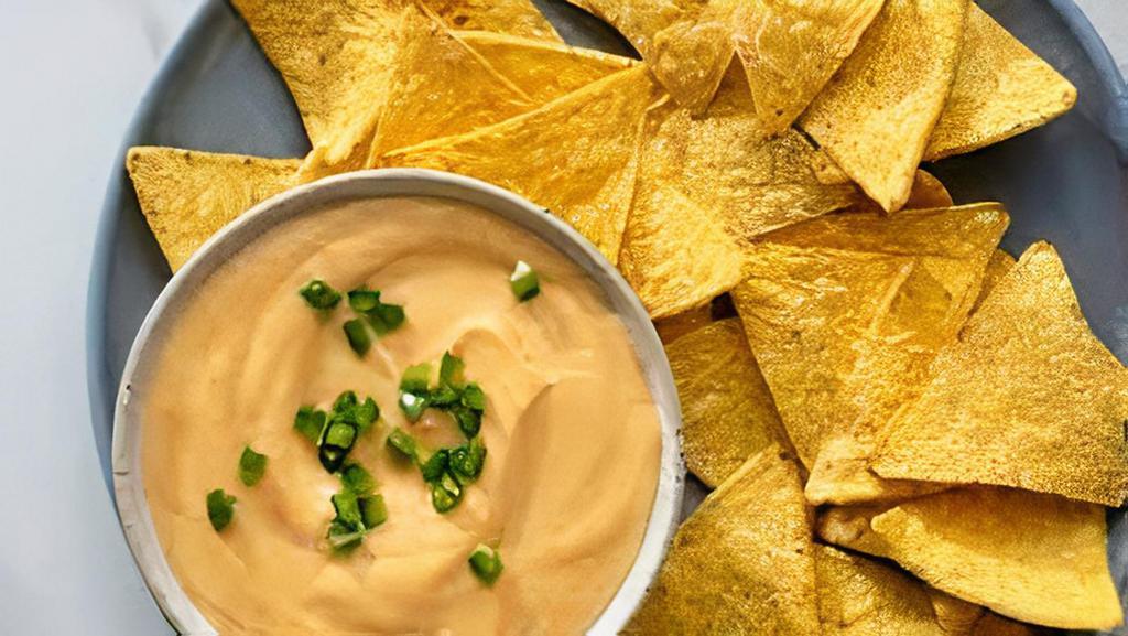 Chips And Queso · Truck made Nett Chips served with melted 3 cheese blend