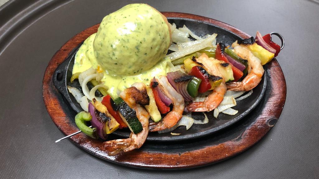 Stuffed Avocado And Shrimp Skewer · Cheese Stuffed Avocado and One Shrimp Skewer containing zucchini, quash and onions. Served with rice, beans and flour tortillas.