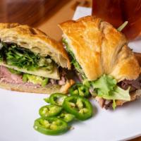 Bee Stinger · Croissant sandwich with roast beef, muenster cheese, jalapenos, mixed greens and our homemad...