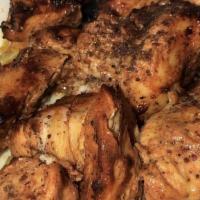 Chicken Tikka Plate · Two skewers of seasoned chicken chunks.