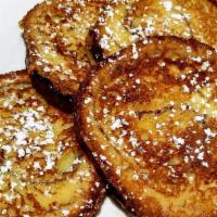 Cinnamon French Toast · Four slices dusted with powdered sugar