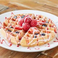 Very Berry Waffle · Topped with fresh strawberries, blueberries and raspberries, vanilla and berry glaze dusted ...