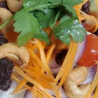 Thai House Salad · Lettuce, tomato, onions, cucumber, carrot, cashew nut, raisin served with special house-made...