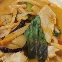 Red Curry · Red curry paste in coconut milk, bamboo shoot, peas, carrots, eggplant, bell pepper and basi...