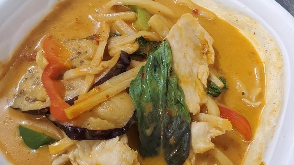 Red Curry · Red curry paste in coconut milk, bamboo shoot, peas, carrots, eggplant, bell pepper and basil leaves with rice.