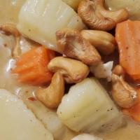 Massaman · Massaman curry paste in coconut milk, cube potato, onions, carrot, top with cashew nut and w...
