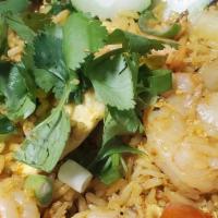 Curry Fried Rice · Fresh cracked egg, scrambled with onions, tomatoes, peas, carrots, wok-fried rice in our hou...