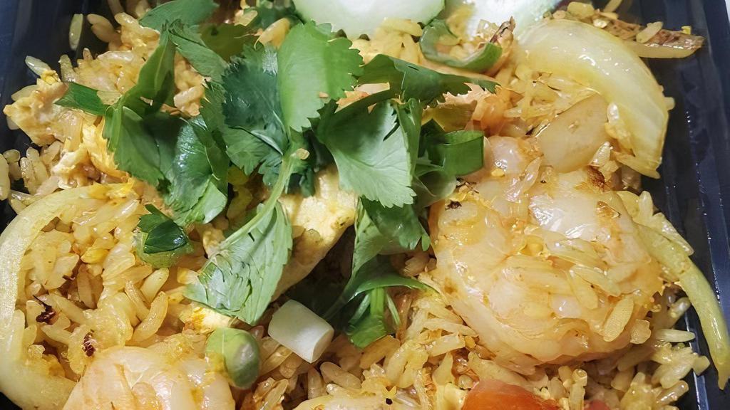 Curry Fried Rice · Fresh cracked egg, scrambled with onions, tomatoes, peas, carrots, wok-fried rice in our house curry sauce