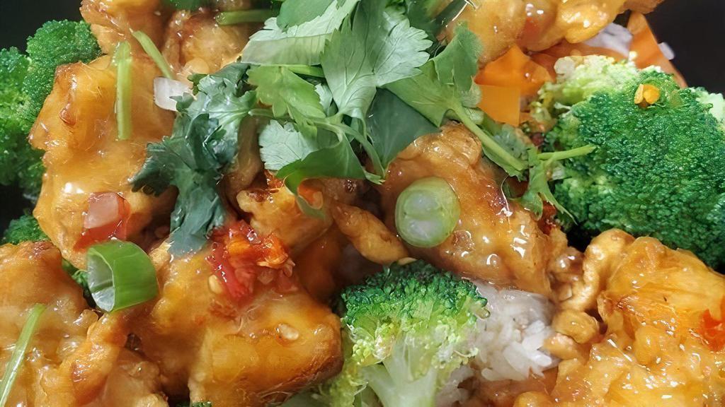 Orange Chicken Rice Bowl · Crispy chicken in our house-made orange sauce on top of steam broccoli and carrot over rice.