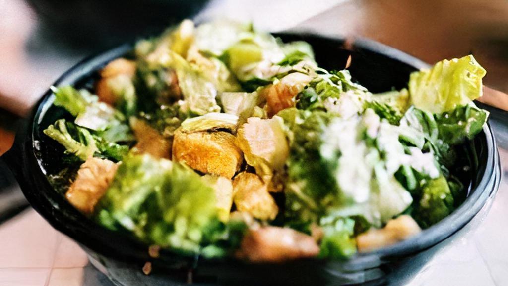 Caesar Salad · Green leaf lettuce, croutons, parmesan cheese, tossed with Caesar dressing.