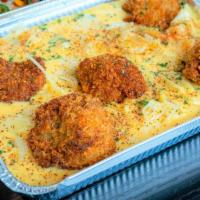 Nashville Hot · Nashville hot chicken chunks in our lucky cheese sauce with bacon bits and jalapenos, topped...