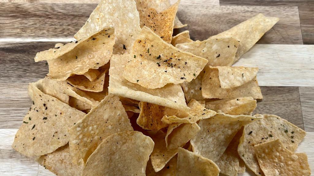 Tortilla Chips  · Fried in house