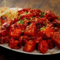 Paneer 65 · Deep fried paneer fritters tossed in spicy curry sauce.
