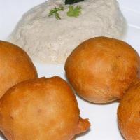 Mysore Bonda · Fried fluffy dumplings made with flour, yogurt and spices.