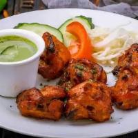 Tandoori Chicken(Half) · Marinated chicken leg quarters (2) with house spices and grilled in tandoor. Served with min...