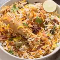 Chicken-Dum Biryani · Marinated chicken cooked with rice and spices. Served with yoghurt dip and spicy sauce.. Spe...