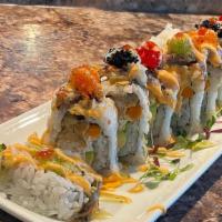 Super Dragon · soft-shell crab, crab meat, avocado, gobo topped with eel, tobiko, eel & spicy mayo, honey w...