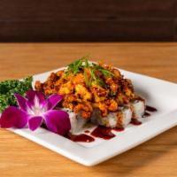 New Orleans Roll · crab meat, avocado topped with baked crawfish, eel sauce, masago, green onion.